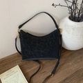 Detailed macro of vintage black leather shoulder bag with gold hardware and logo plate - No Pendant / Black