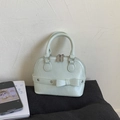 Mint green shell bag with bow decoration and double zip closure in litchi grain PU - Green