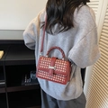 Red woven crossbody square bag with a twisted handle and metallic silver buckle - Dark Red