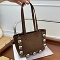 Dark brown suede shoulder bag featuring bold silver metallic studs and rivet accents - Brown