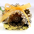 Golden laser-cut hollow gift box with floral pattern and orange ribbon for weddings - Reflective Gold