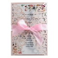 Detail of laser-cut rose gold wedding invitation with pink ribbon and floral insert card - Light Pink