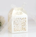 Elegant laser-cut heart pattern wedding favor box with cream ribbon bow on white background - Starry White