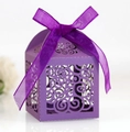 Detail of purple laser-cut candy box with scroll patterns and satin ribbon bow - Dark Purple