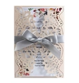 Detail of laser-cut floral wedding invitation with pink flowers and a grey satin ribbon - Nude Pink
