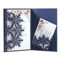 Detail of laser-cut navy blue snowflake invitation with elegant floral inner card - Magic Blue