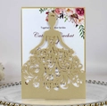 Macro detail of laser-cut bridal silhouette on a gold wedding invitation sleeve - Beige Gold