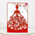 Elegant laser-cut red wedding invitation with lace dress pattern on gold beaded tray - Pearlescent Red