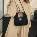 Black faux shearling handbag with leather handle and silver turn-lock buckle - Black