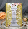 Elegant laser-cut wedding invitation in pearlescent gold with pink floral inner card - Reflective Gold