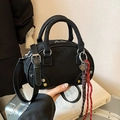 Minimalist black faux suede crossbody bag with heart charm and woven strap detail - Black with Pendant