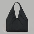Close-up of a large black tote bag featuring lightweight pleated fabric for casual daily use - Black