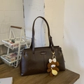 Detail of dark brown tote bag with dual straps and a cute plush bear charm accessory - Coffee with Pendant