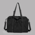 Detail of black nylon tote bag showing front drawstring pocket and durable texture - Black