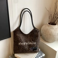 Chic leopard print tote bag with embroidery on top of a suitcase for a stylish look - Brown