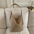 Large camel suede hobo bag with wide shoulder strap on beige sofa background - Khaki (No Pendant)