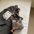 Blue denim and brown leather bucket bag with retro geometric woven shoulder strap - Blue Without Charm