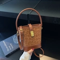 Matte leather leopard print bucket bag with gold hardware and adjustable strap - Brown