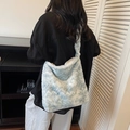 Light blue faux fur tote bag for women with soft plush texture and wide shoulder strap - Blue