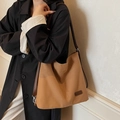 Brown canvas hobo bag with adjustable leather strap for stylish women's commuting - Brown