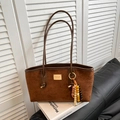 Brown suede shoulder bag with leopard accent bead charm and gold nameplate detail - Brown with Pendant