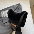 Furry black faux fur bucket bag with adjustable leather strap in classic black - Black