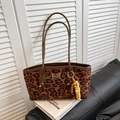 Leopard print tote bag with brown leather handles and a colorful beaded tassel charm - Brown Leopard with Pendant