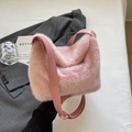 Pink fluffy faux fur bucket bag with adjustable leather shoulder strap for winter fashion - Pink