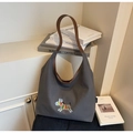 Detail of grey canvas tote bag featuring rainbow zebra embroidery and brown leather straps - One Size / Dark Brown