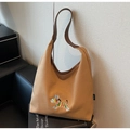 Close-up of zebra embroidery on brown canvas tote bag with leather strap and hobo style - One Size / Brown