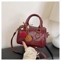 Retro wine red barrel bag in distressed oil wax leather with decorative fur pom pom charm - With Charm / Burgundy