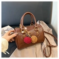 Brown vintage cylinder boston bag in wrinkled leather with decorative pompom charms - With Charm / Brown