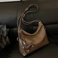 Brown vintage faux leather bucket bag with dog charm and knotted shoulder strap - Beige Khaki With Charm