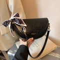 Elegant black saddle bag with vintage texture and heart pattern silk scarf accessory - Black
