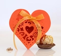 Detail view of red heart laser-cut candy box with gold ribbon for Valentine gifts - Orange Red