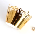 Macro shot of gold hollow laser-cut cupcake wrappers with intricate cross and vine patterns - 5cm / Reflective Gold