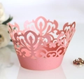Close-up of pink pearlescent laser-cut cupcake wrappers with elegant lace pattern - Pink (5x5x8cm)