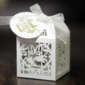 Detail view of laser-cut wedding favor box featuring love birds and floral patterns - White (With Tag)