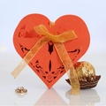 Laser-cut heart-shaped candy box in bright orange-red with golden ribbon bow - 50 Pieces / Orange Red