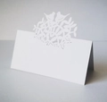 Elegant white laser-cut place card with tree of life and birds on a grey background - White