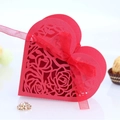 Red heart-shaped gift box featuring laser-cut rose patterns and a matching silk ribbon bow - Pearlescent Red
