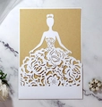 Detail of laser-cut floral gown design on white invitation card with kraft insert - White And Kraft Paper