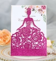 Macro detail of laser-cut rose gold glitter wedding invitation with floral lady design - Glitter Rose Red
