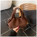 Detail of dark brown suede handbag with gathered texture and golden hardware accents - Brown