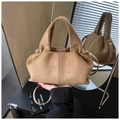 Detail of pleated suede bucket bag in tan with gold-tone hardware and top handle - Khaki