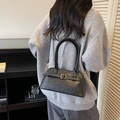 Minimalist black faux leather shoulder bag with lychee texture and metal buckle detail - Black