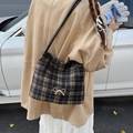 Brown plaid bucket bag for women featuring a gold bow buckle and black leather strap - Black