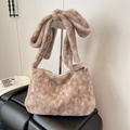 Chic khaki faux shearling shoulder bag featuring a large decorative plush bow accent - Grey-Beige