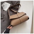 Detailed view of khaki pebbled leather shoulder bag with metallic clasp and top handle - Khaki