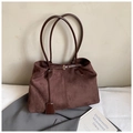 Detailed view of dark brown suede tote bag with leather straps and metal buckle accent - Brown